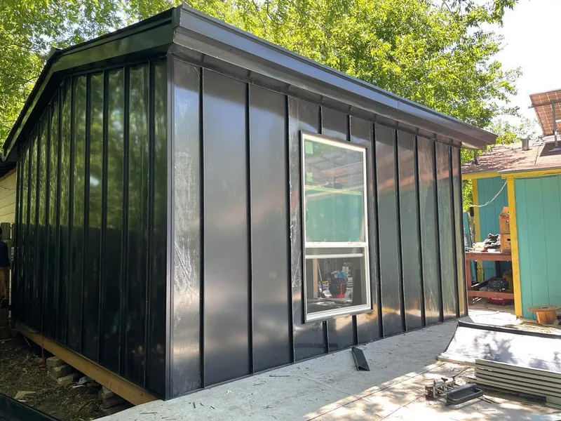 Black standing seam metal wall panels for Roof Inspection in Waggaman