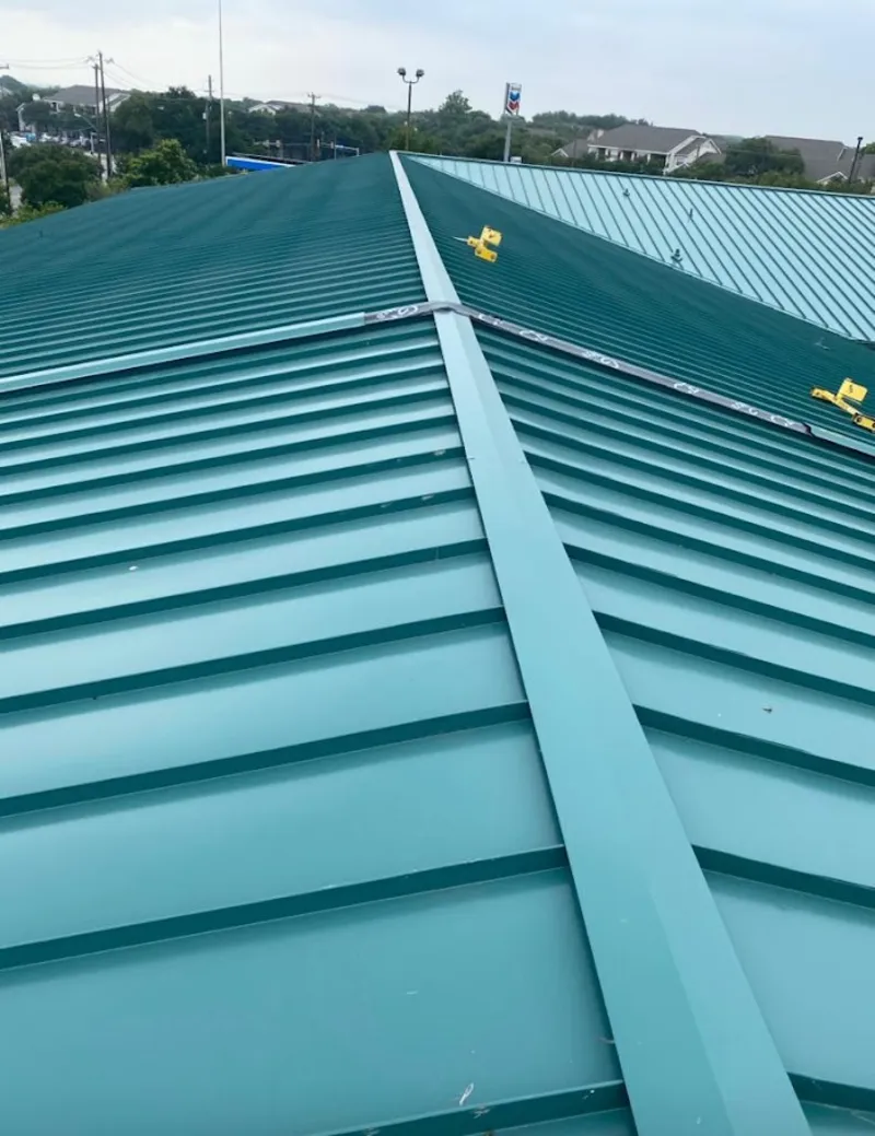 Green commercial metal roof ridge and valley for Metal Roof Repair in Waggaman